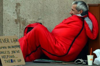 Homeless Man With Red Sleeping Bag