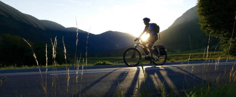 Man Riding Electric Bike Sunset