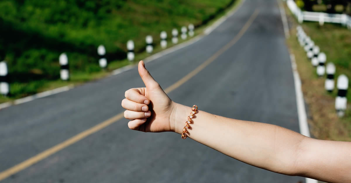 Thumb Out Hitchhiking On Highway