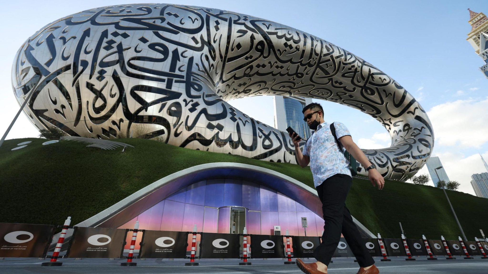 A man walks past the Dubai Museum