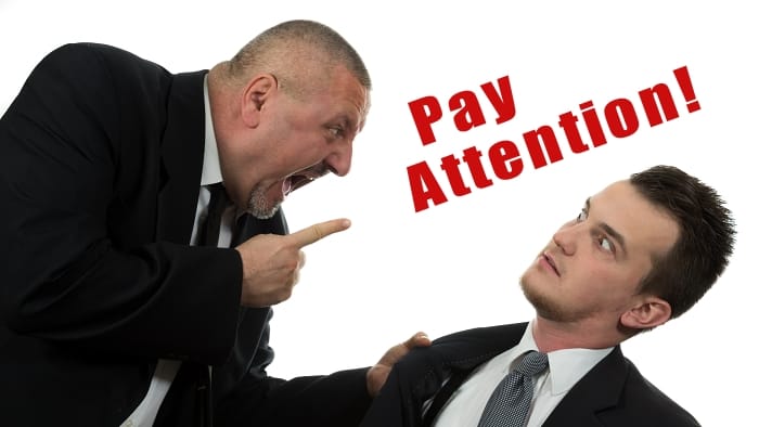 man telling someone to pay attention
